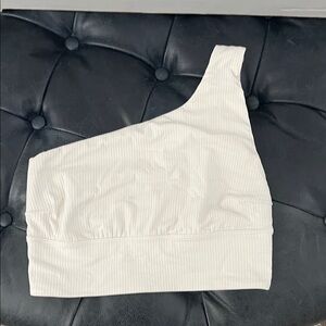 Lululemon woman’s sports bra.  Like new cute beige one strap.  Size 4